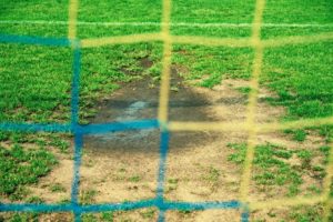 Football penalty area bare turf